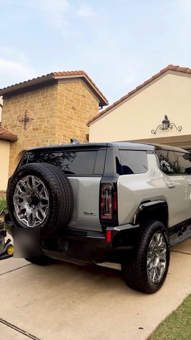 GMC Hummer EV parked in a driveway after an exterior detail, Ongowash mobile detailing serving Katy, TX