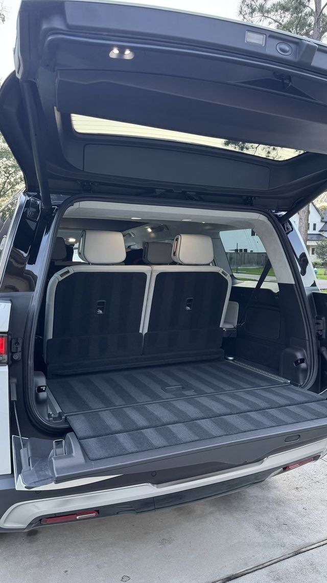 Porsche Macan Electric rear cargo area vacuumed, Ongowash mobile detailing serving Stafford, TX