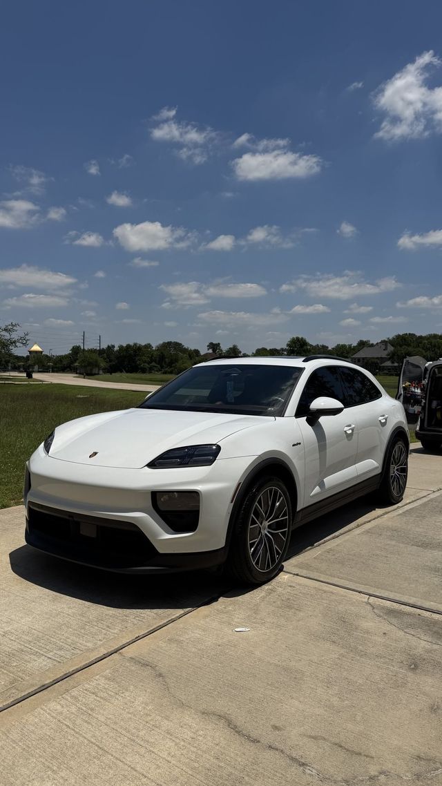 White Porsche Macan Electric after a mobile EV detail, Ongowash mobile detailing serving Pearland, TX
