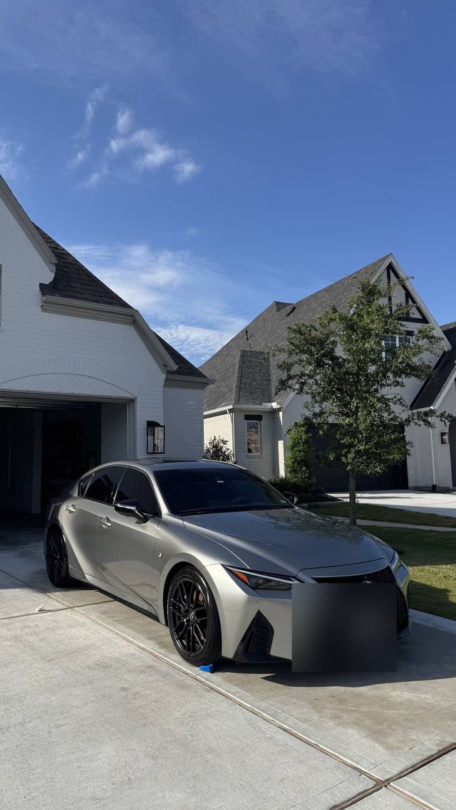 Silver Lexus IS sedan in a driveway after a mobile exterior detail, Ongowash mobile detailing serving Richmond, TX