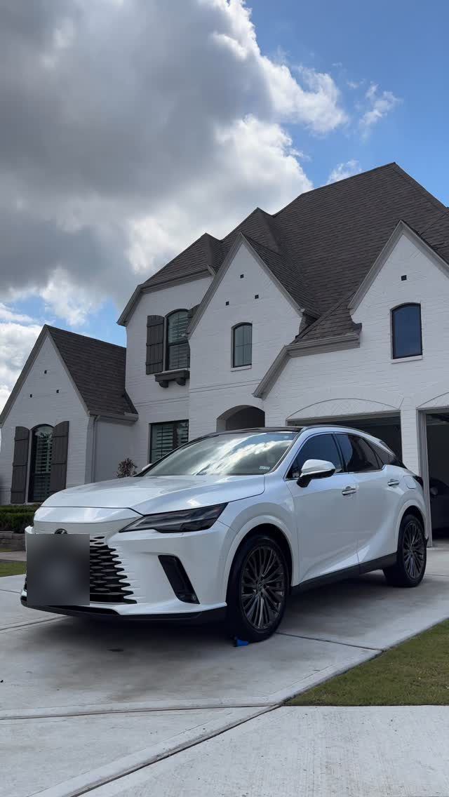 White Lexus RX in a driveway after a mobile exterior detail, Ongowash mobile detailing serving Cypress, TX