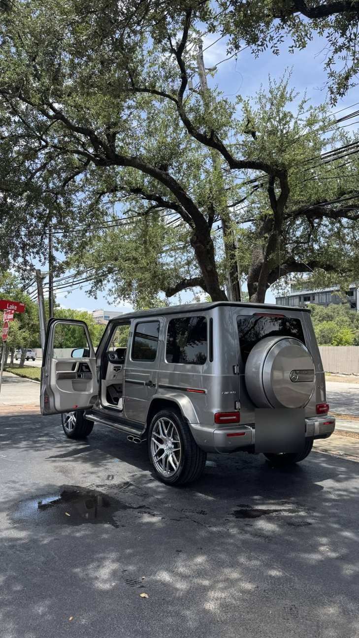 Silver Mercedes-AMG G63 with doors open during a mobile detail, Ongowash mobile detailing serving Stafford, TX