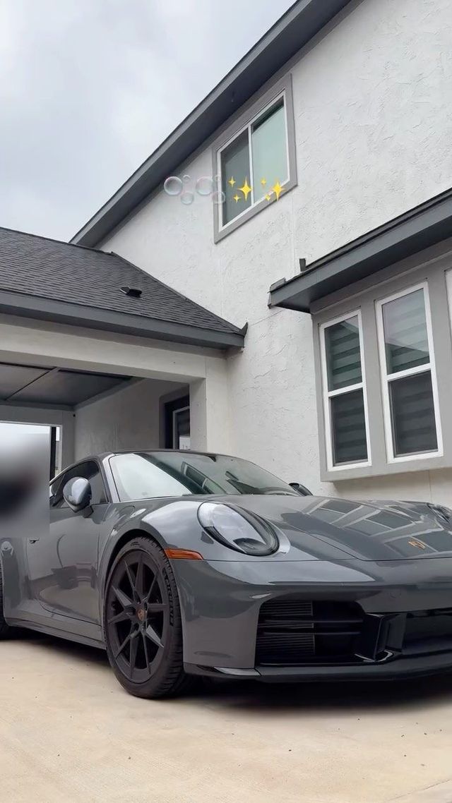 Gray Porsche 911 in a driveway after a mobile exterior detail, Ongowash mobile detailing serving Katy, TX
