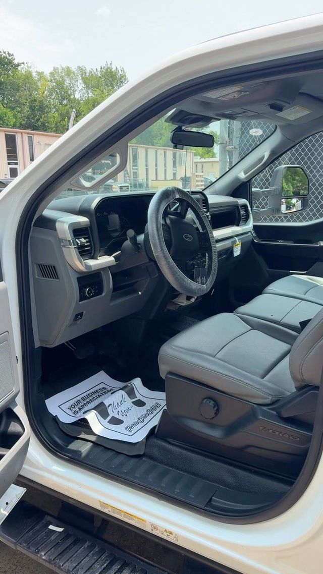 Ford pickup interior cleaned with protective seat cover in place, Ongowash mobile detailing serving Stafford, TX