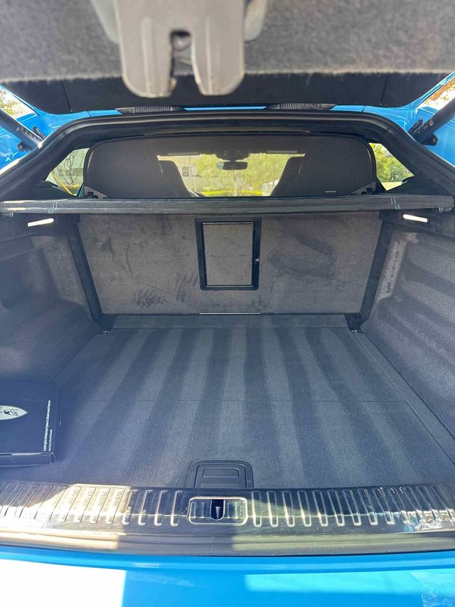Lamborghini Urus cargo area vacuumed with fresh carpet lines, Ongowash mobile detailing serving Pearland, TX