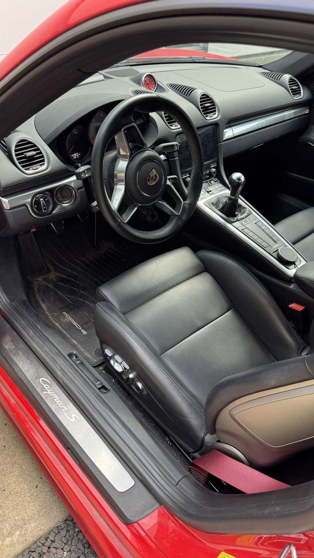 Red Porsche 718 interior with clean leather seats and dash, Ongowash mobile detailing serving Stafford, TX