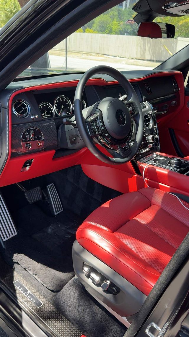 Rolls-Royce Cullinan interior with red leather seats after detailing, Ongowash mobile detailing serving Pearland, TX