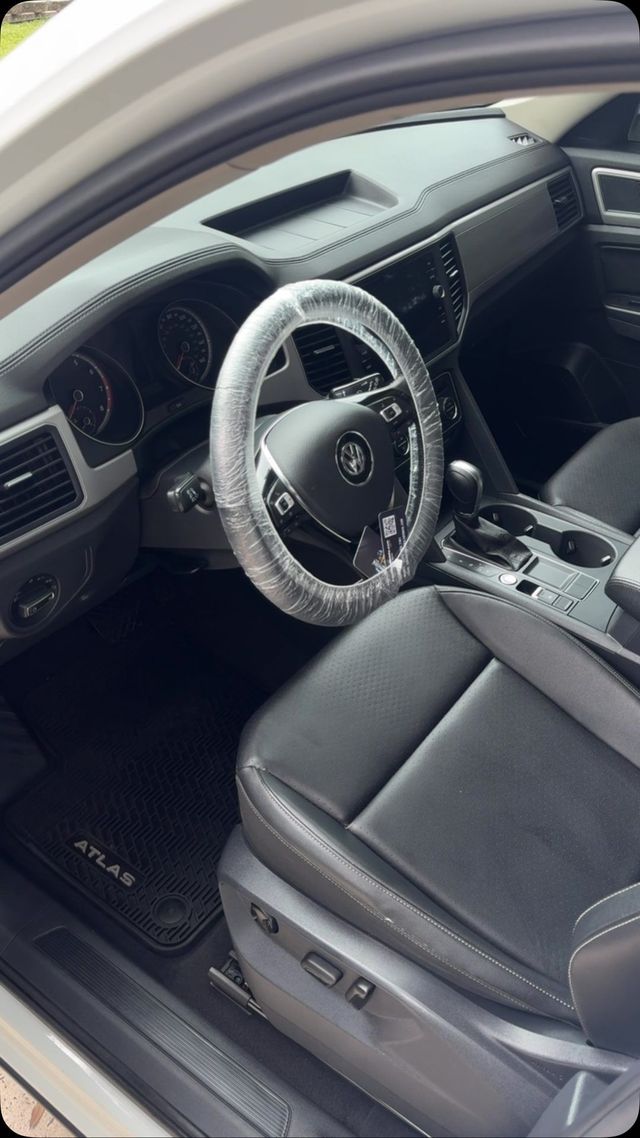 Volkswagen SUV front cabin cleaned with steering wheel cover on, Ongowash mobile detailing serving The Woodlands, TX