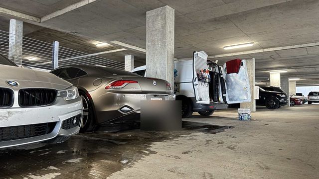Ongowash van set up in an apartment parking garage between client cars, Ongowash mobile detailing serving Richmond, TX