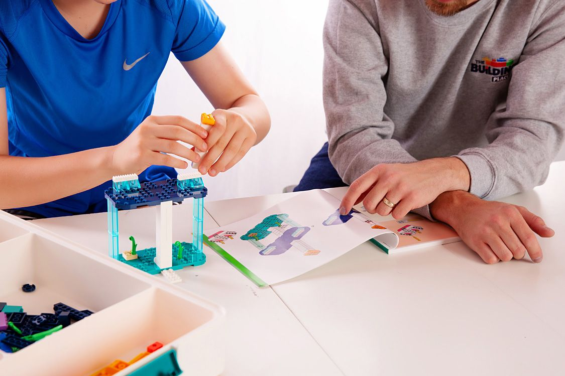 Student and teacher building a LEGO® Education kit together