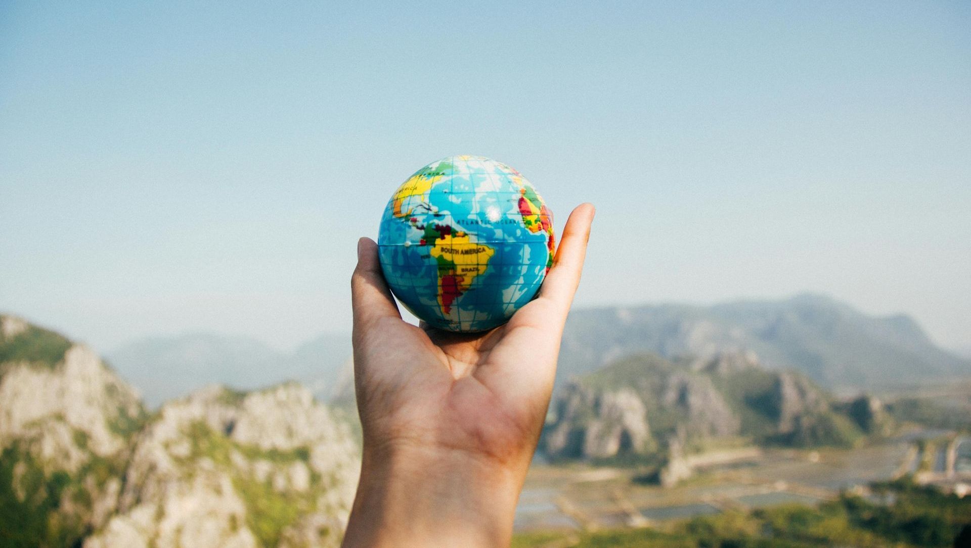 a person holding a globe