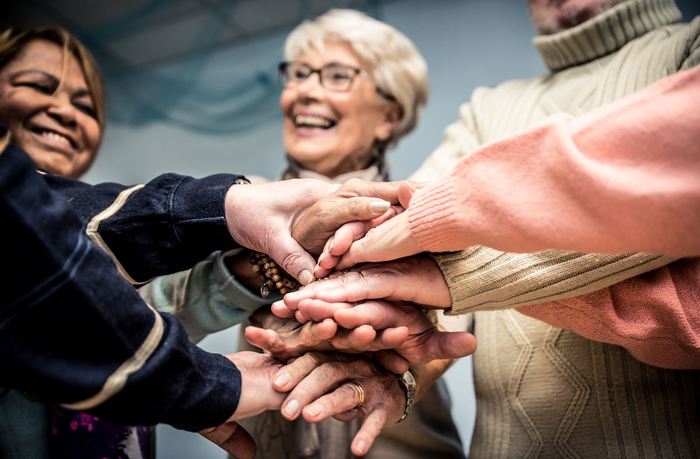 Seniors hands together