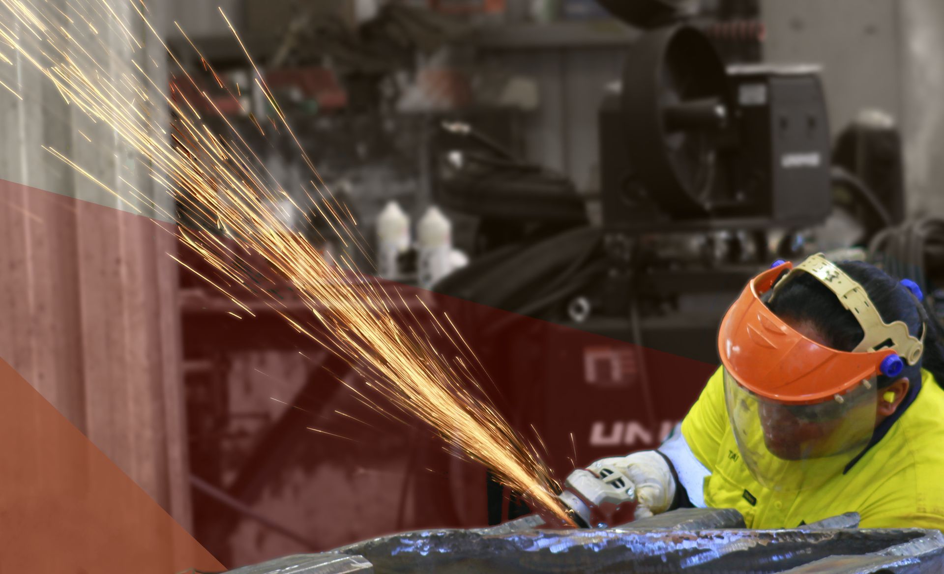 A person is grinding a piece of metal with a grinder.
