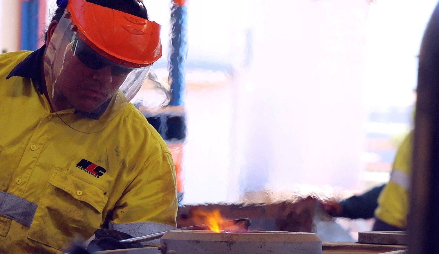 a man cutting some mild steel a man cutting some mild steel