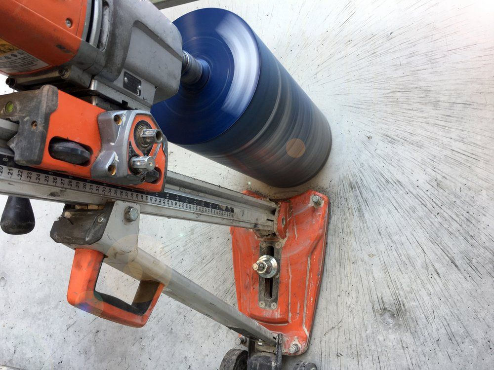 Machine Drilling Concrete — Concrete Cutters In Kempsey, NSW