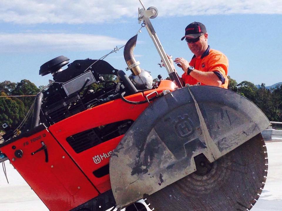 Worker With His Concrete Cutter — Concrete Cutters In Port Macquarie, NSW