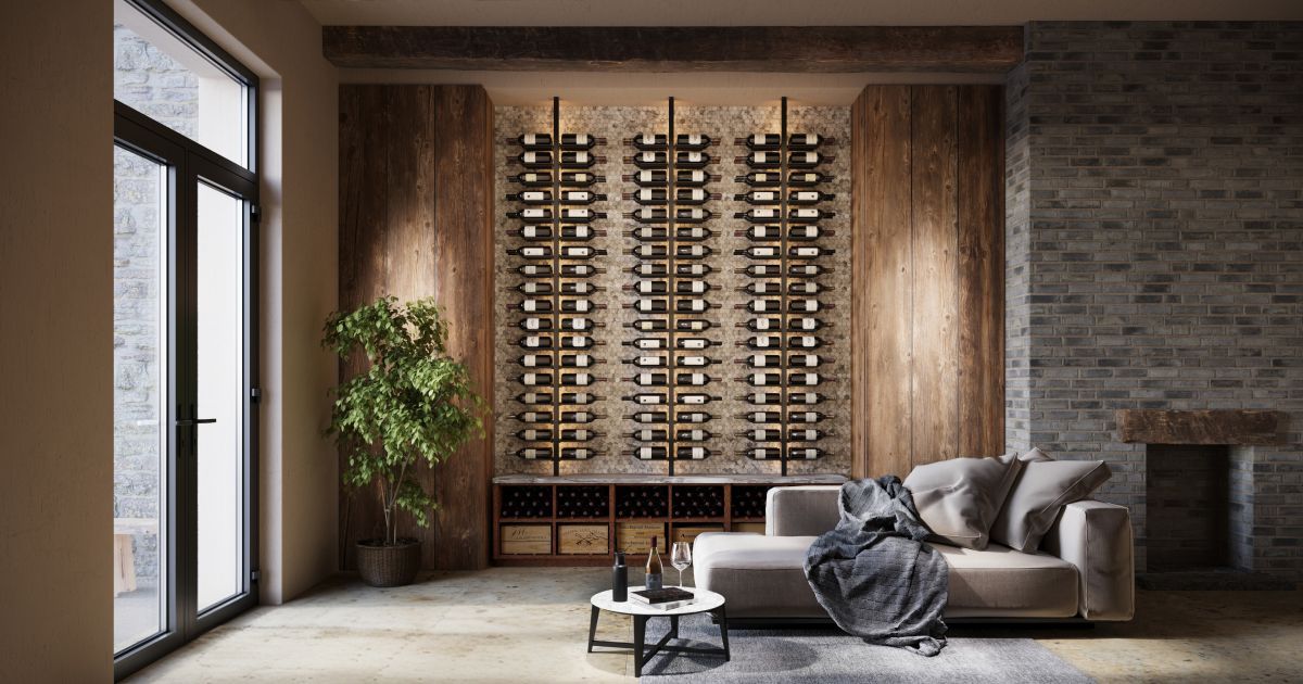 Modern living room with large windows, wood wine rack wall, gray sofa, and plant beside a brick fireplace.