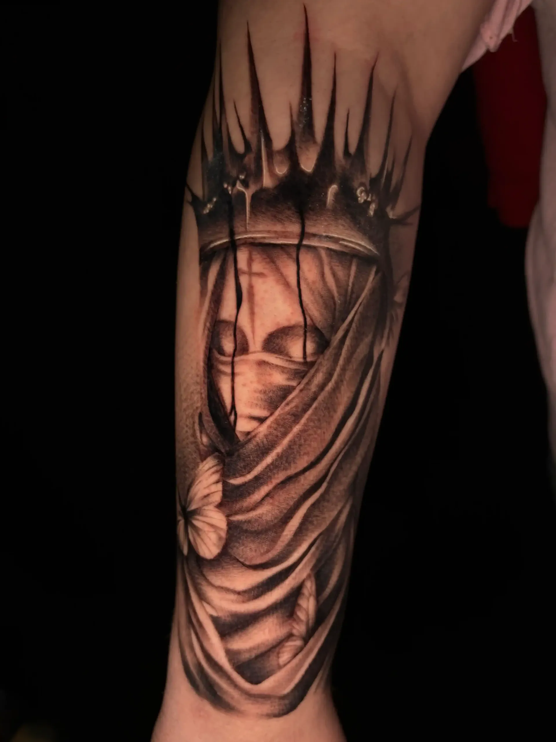 black and white realism portrait of a draped figure 