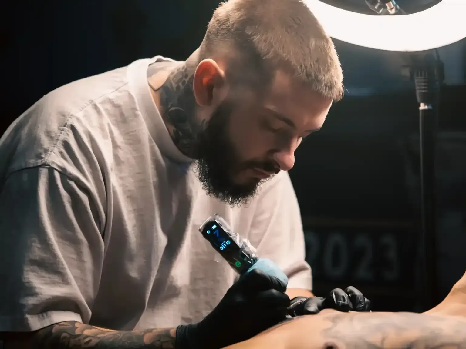 Mickey working on a chest tattoo 