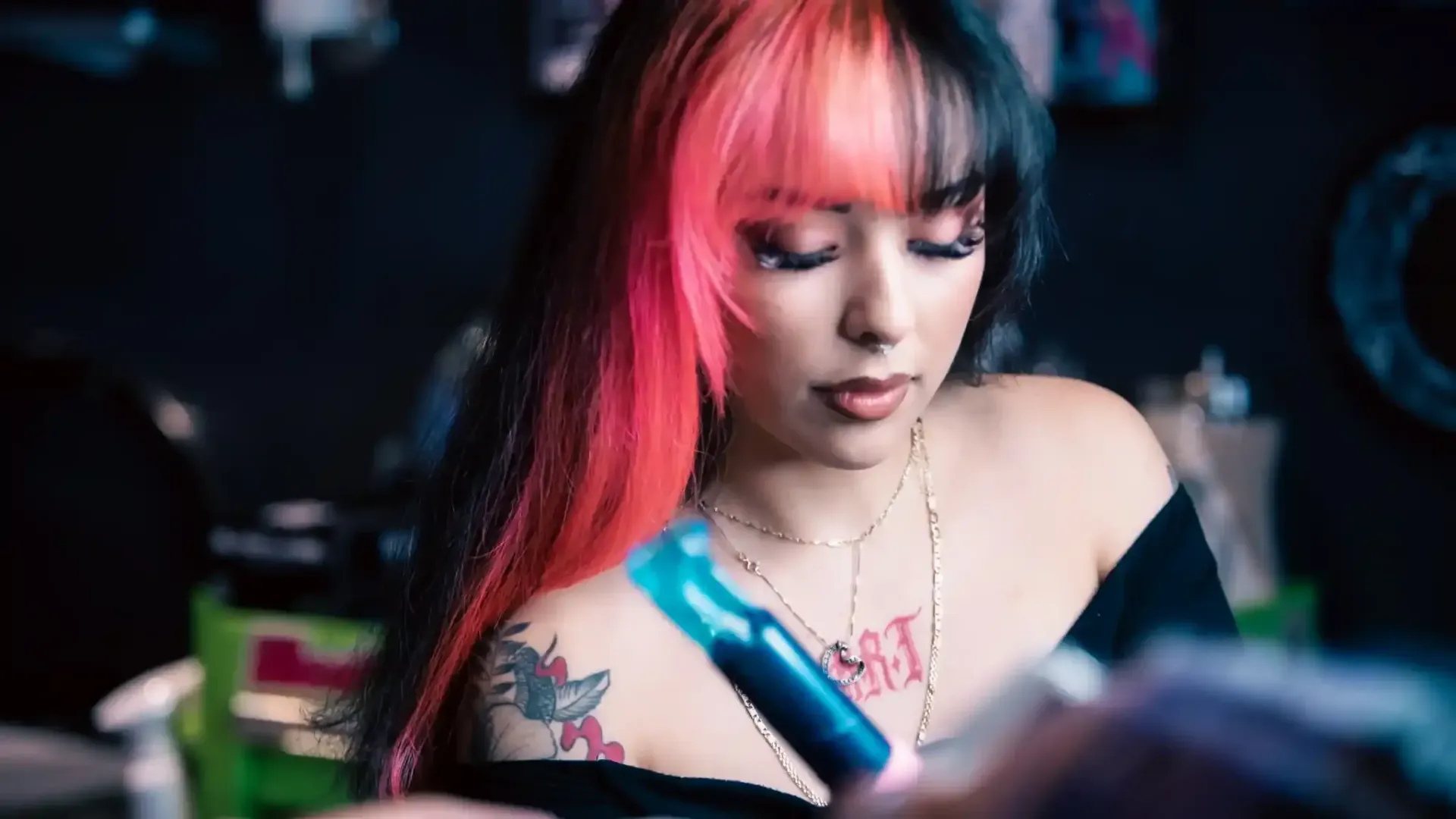 Littie tattooing a forearm 