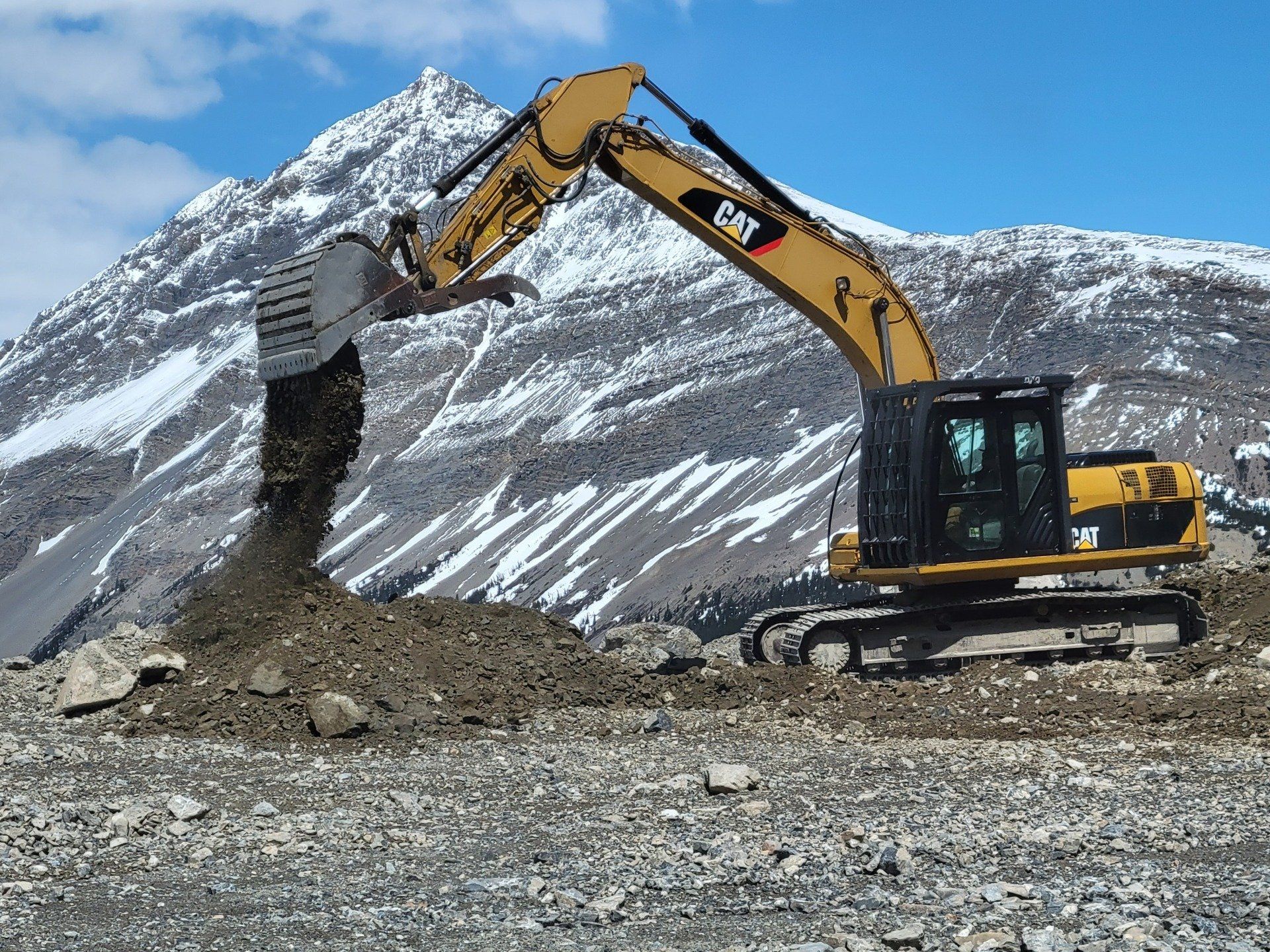 Excavator dumping dirt