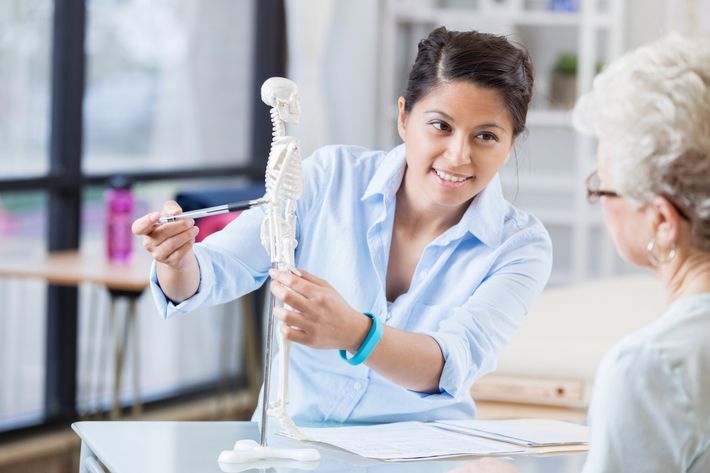 Chiropractor with Her Patient — Beaumont, TX — Gulf Coast Chiropractic