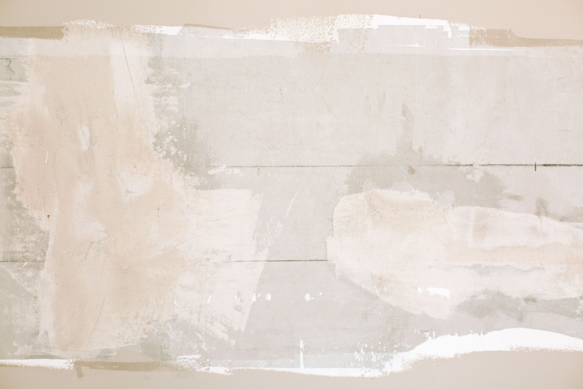 Abstract beige and white textured brushstrokes on a soft neutral background