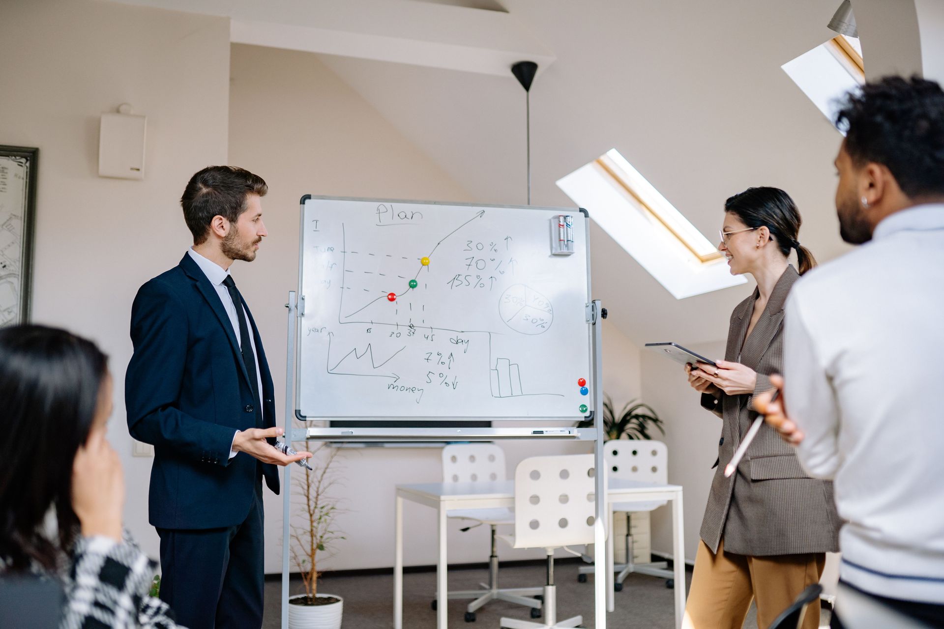 Two people looking at a computer with accounting software | Featured image for the Business Services page for Rudd Mantell Accountants