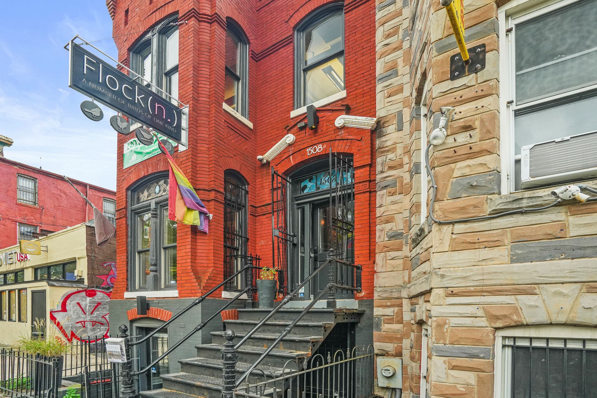 Renovated brick commercial building entrance with metal stairs