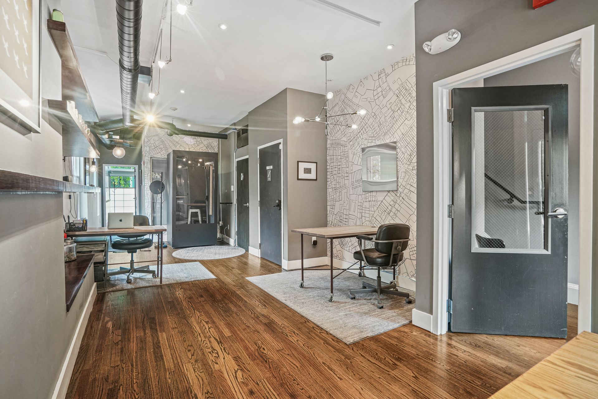 Spacious office hallway with polished wood floors