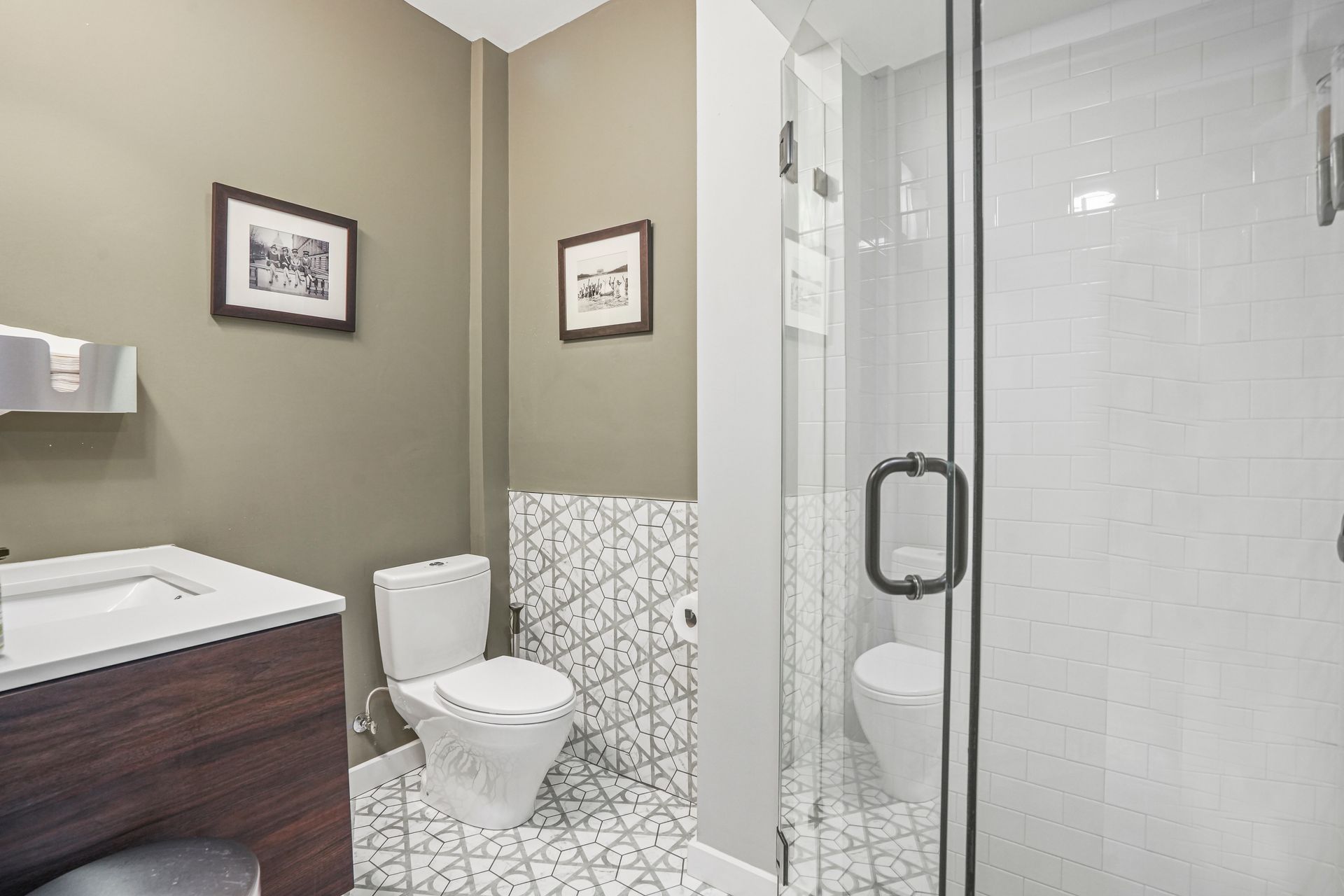 Modern restroom with toilet and glass shower enclosure
