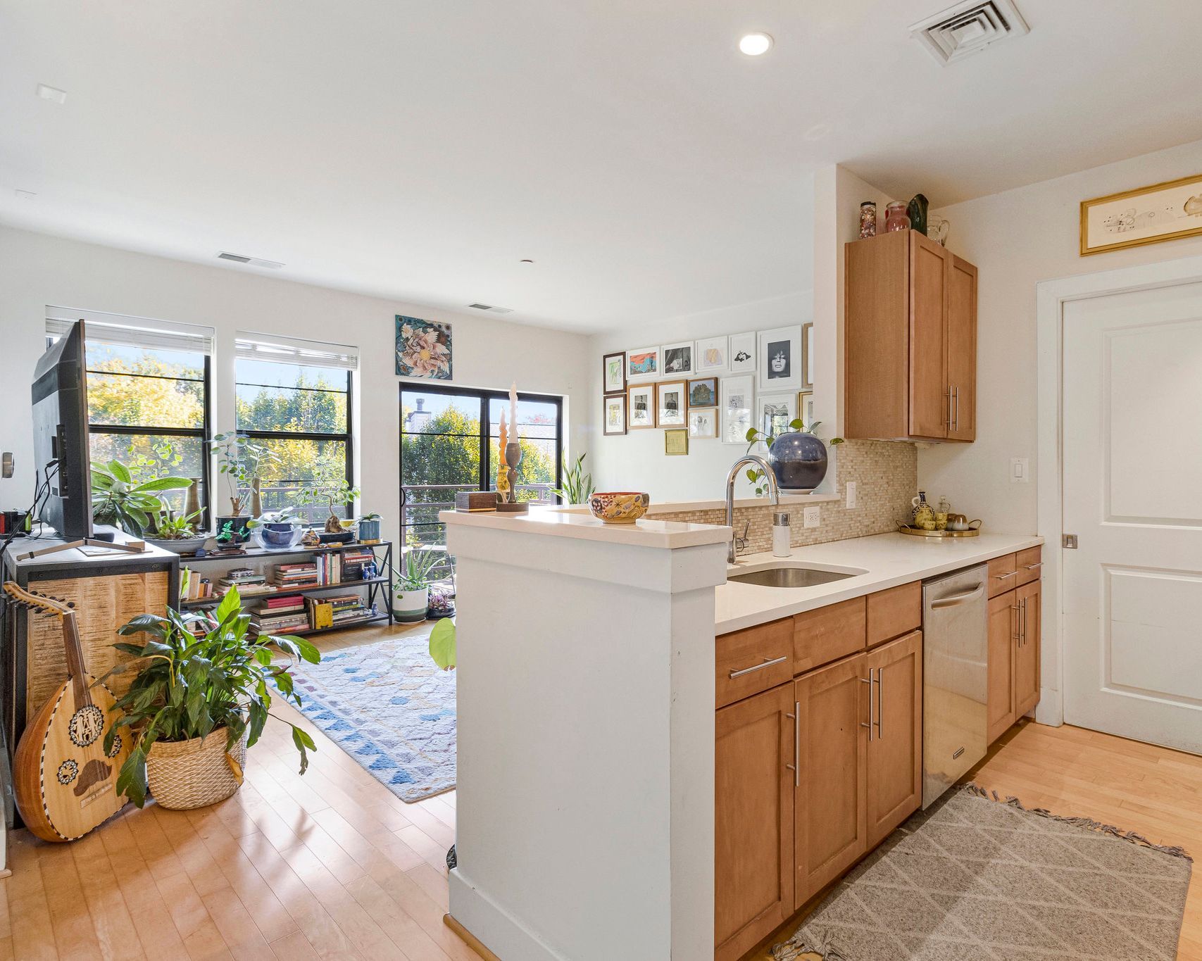 Open-concept apartment kitchen with island seating