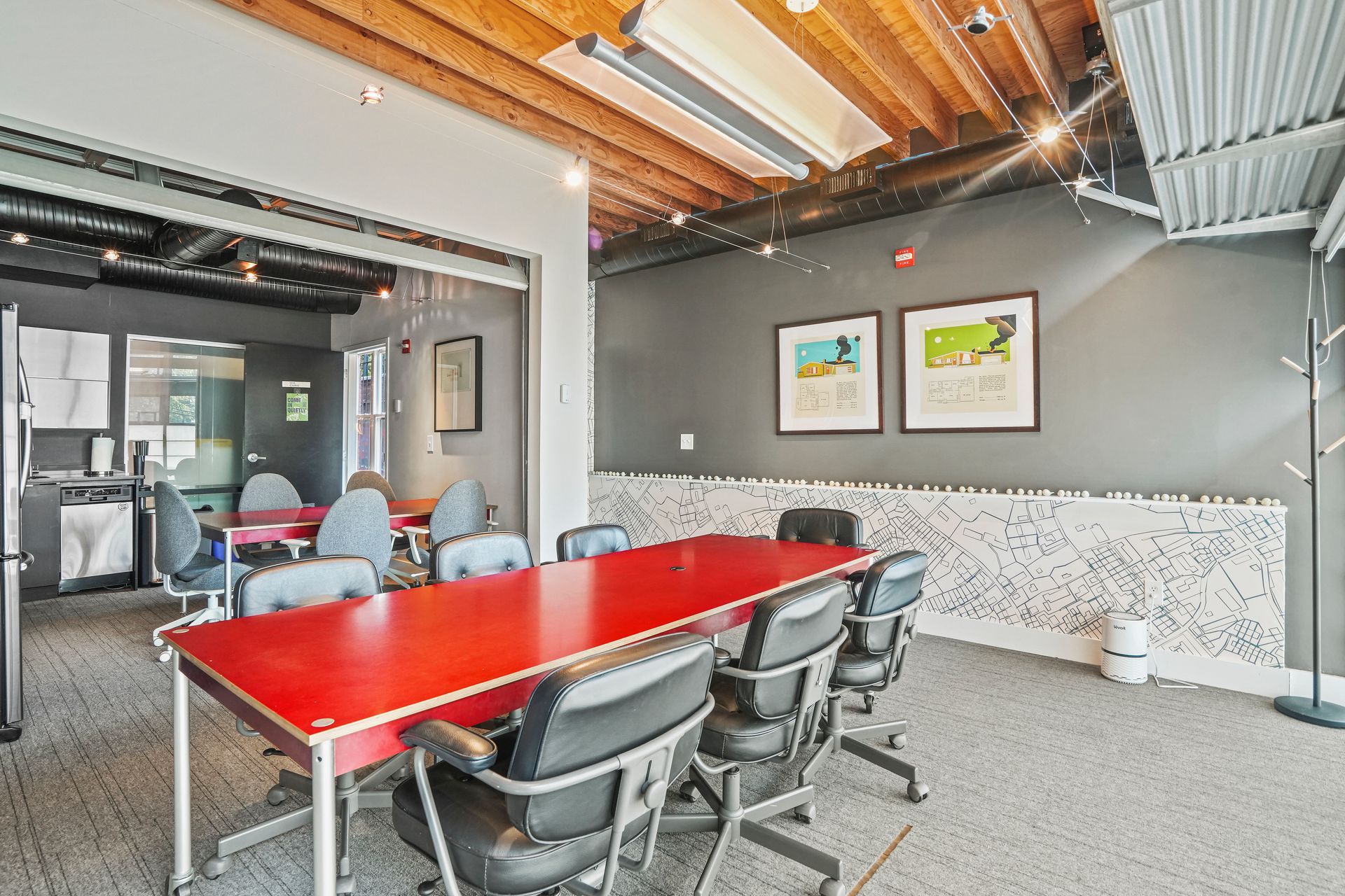 Conference room with red table and modern office furnishings