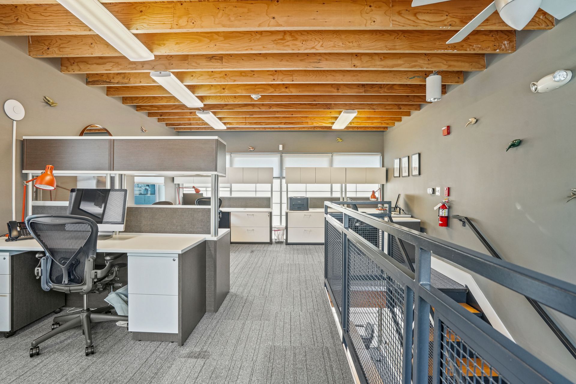 Commercial office entrance with elevator access and seating area