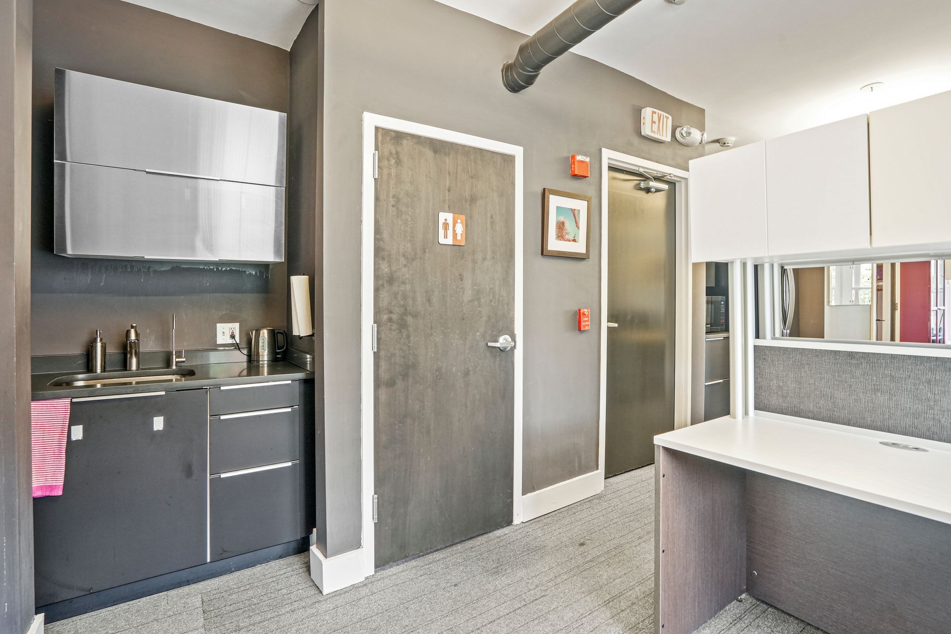 Contemporary restroom vanity with decorative tile backsplash