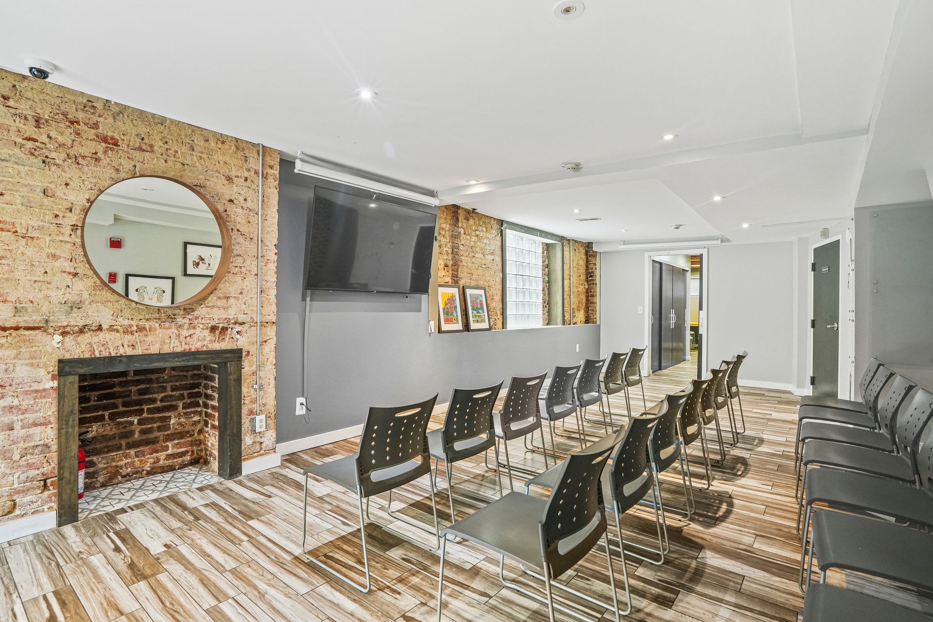 Community event space with dining tables and fireplace