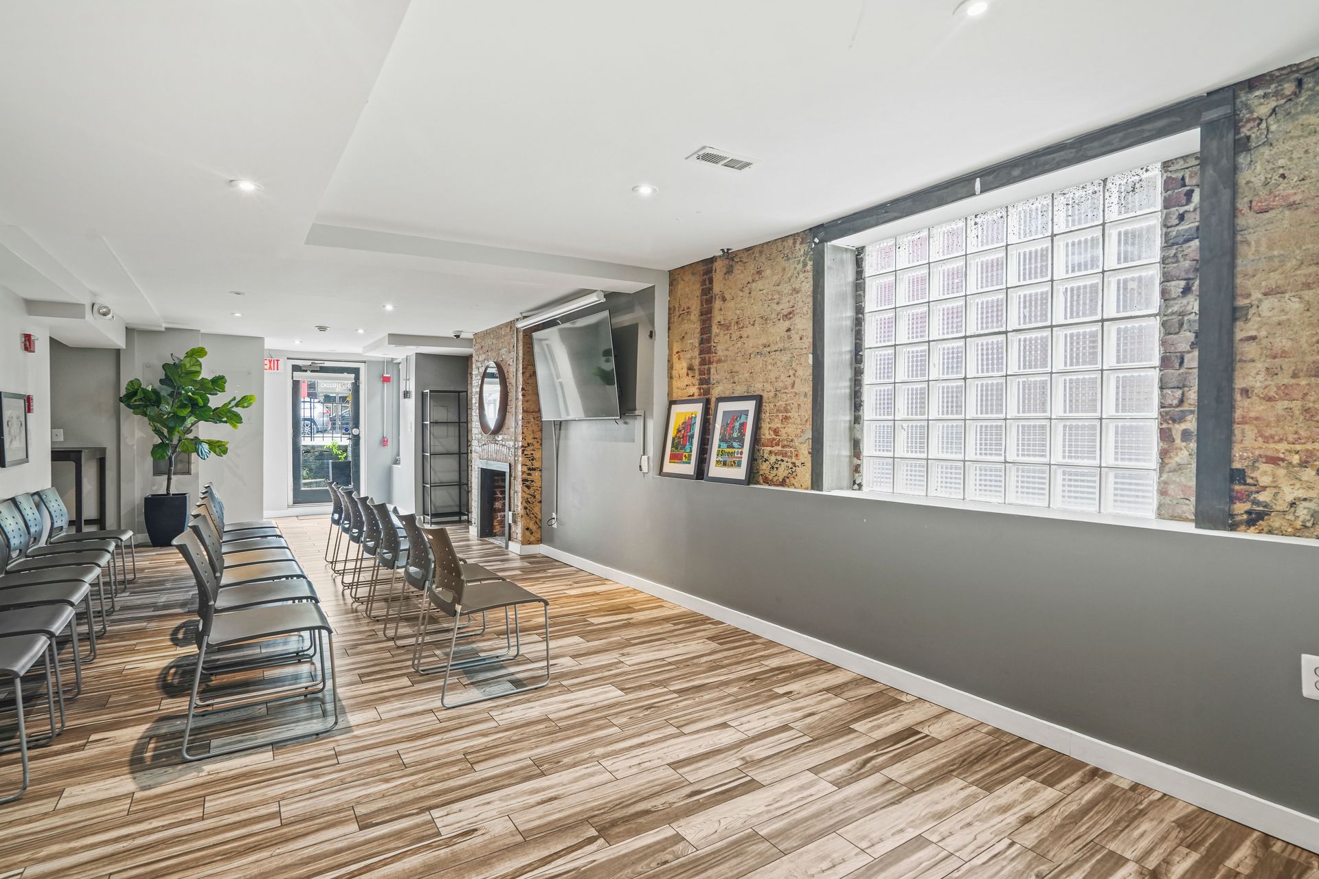 Modern office lounge with shelving and workspace desk