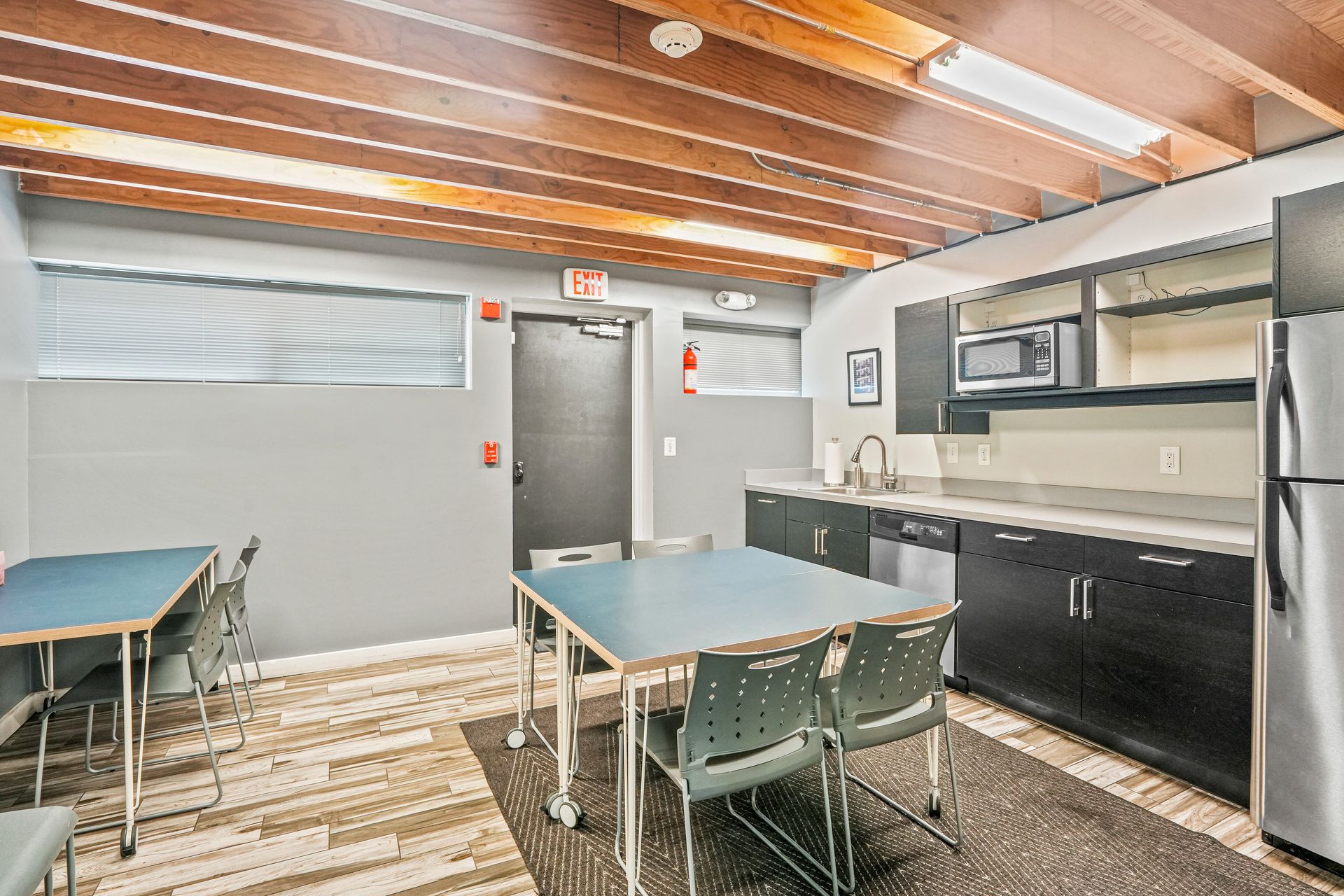 Meeting room with conference table and industrial-style ceiling