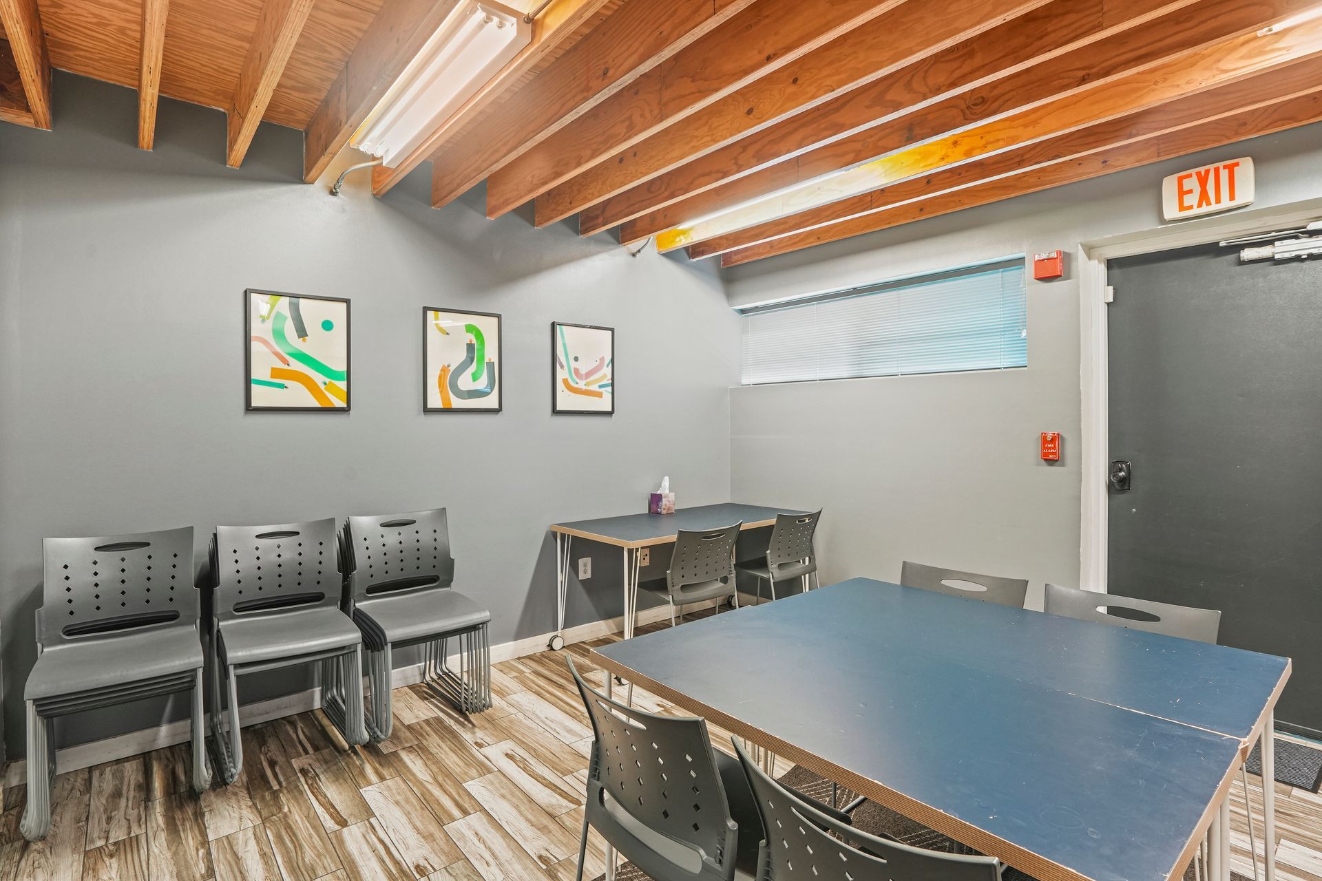 Conference room with exposed beams and modern furnishings