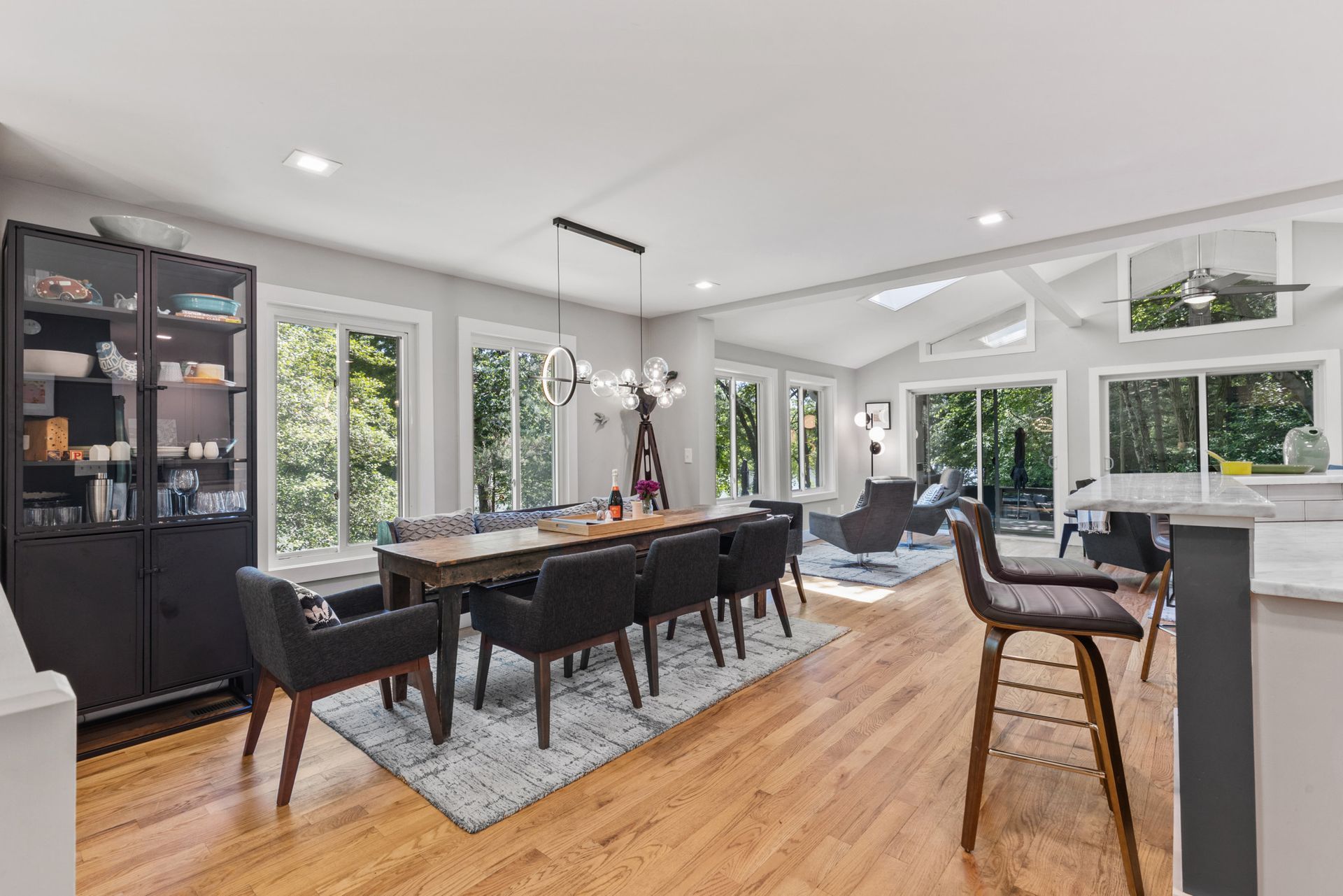 Open dining area with large windows and modern furnishings