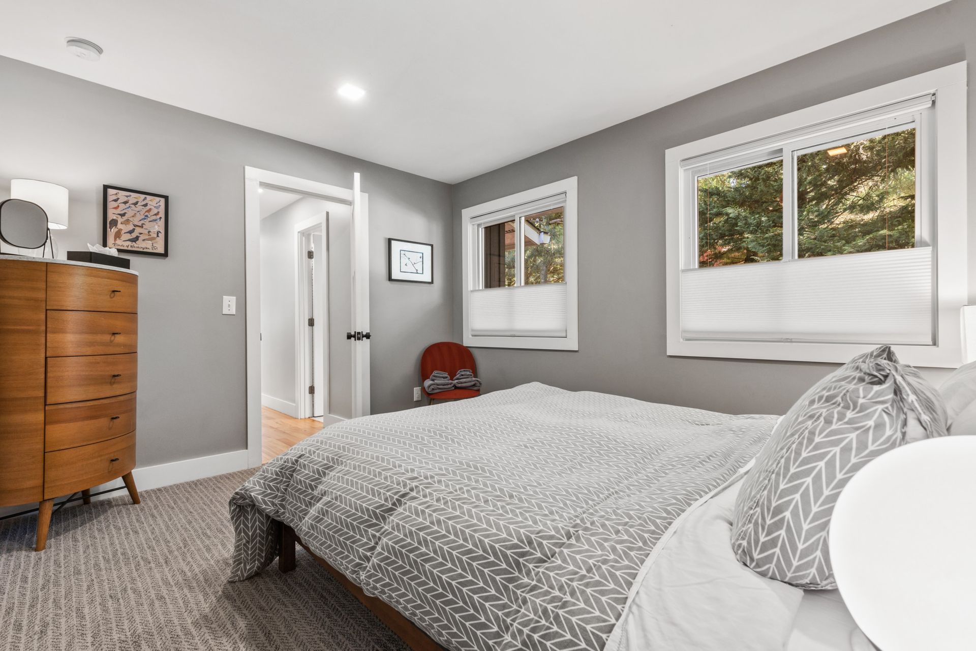 Apartment bedroom with wood furnishings and natural light