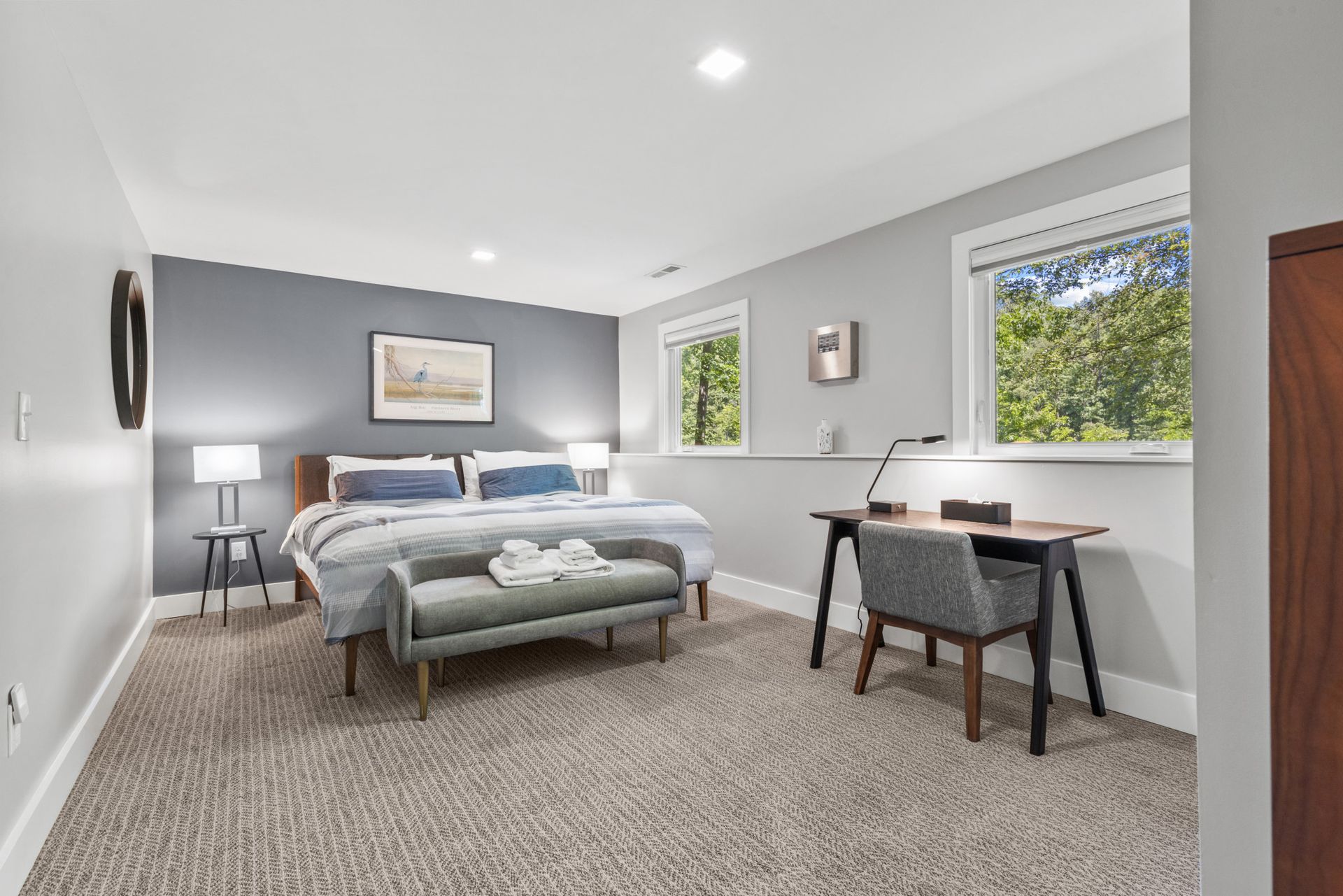 Bright bedroom with large windows and natural sunlight