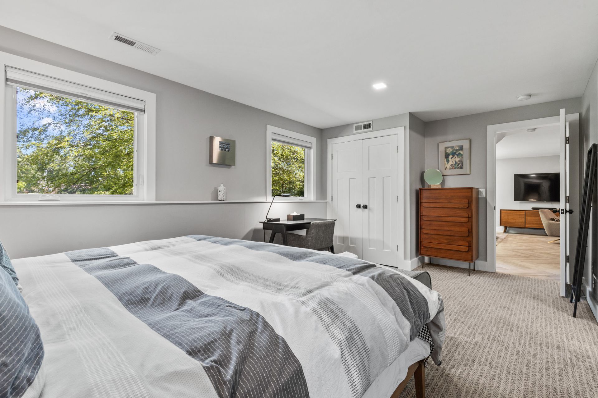 Bright living room with neutral decor and large windows