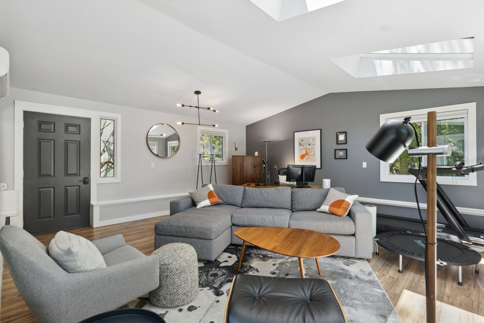 Open-concept living room with modern kitchen and dining area