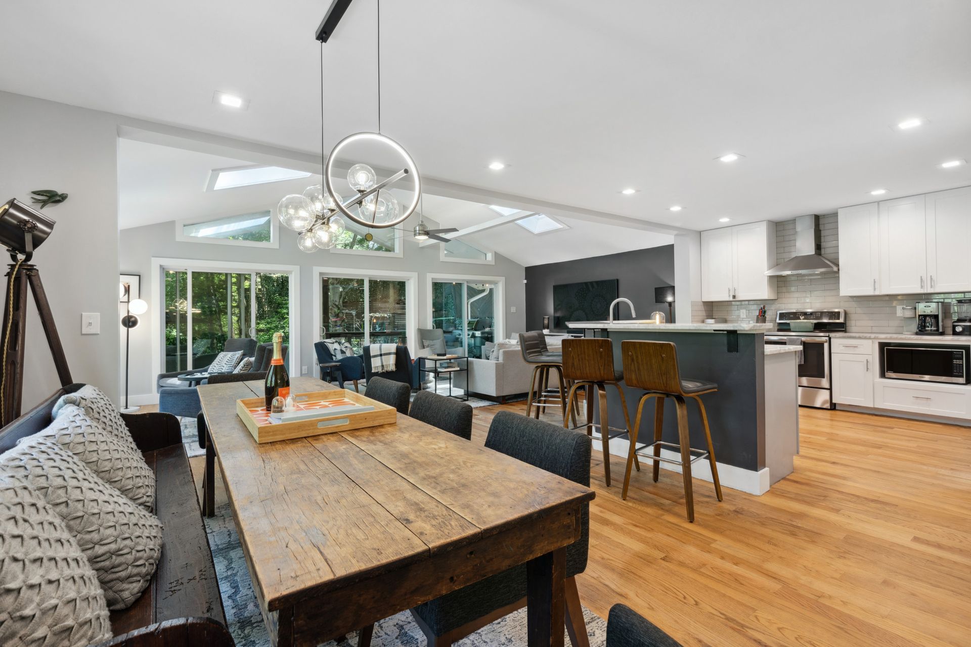 Modern open-concept kitchen and living area with large windows