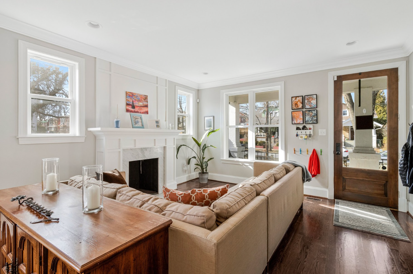 Bright living room with neutral decor and large windows