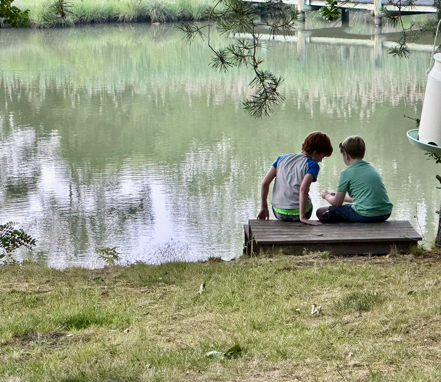 Family enjoying a peaceful lakeside nature setting