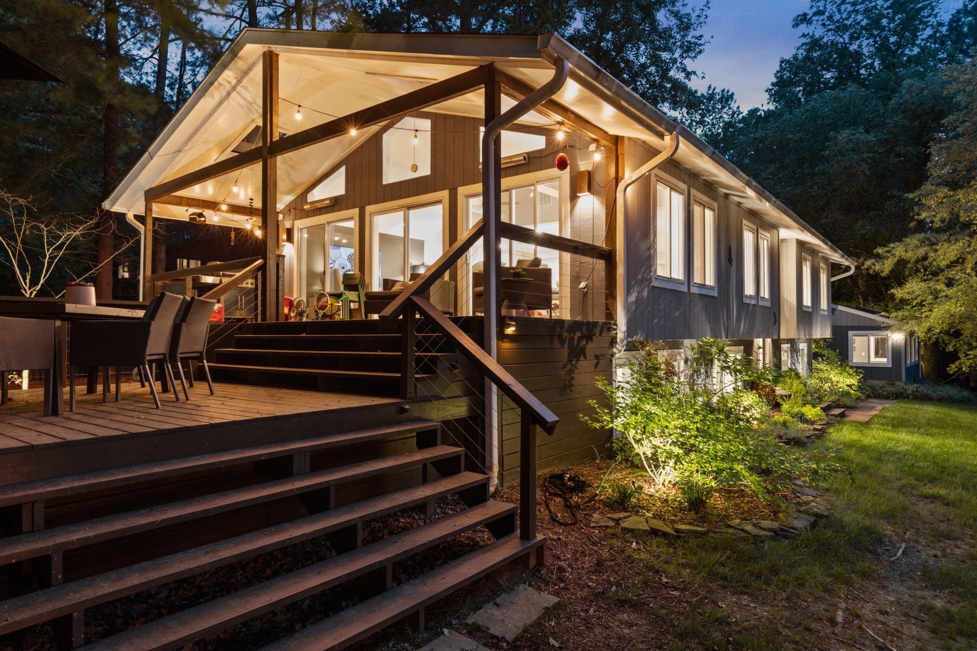 Rustic cabin exterior surrounded by mature trees
