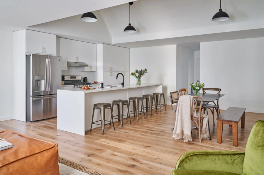 Co-Living space in a warm open kitchen and dining area with great lighting