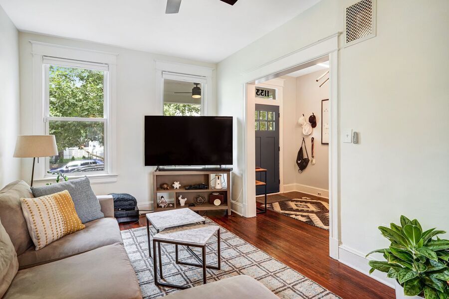 Nest DC furnished living room with open window